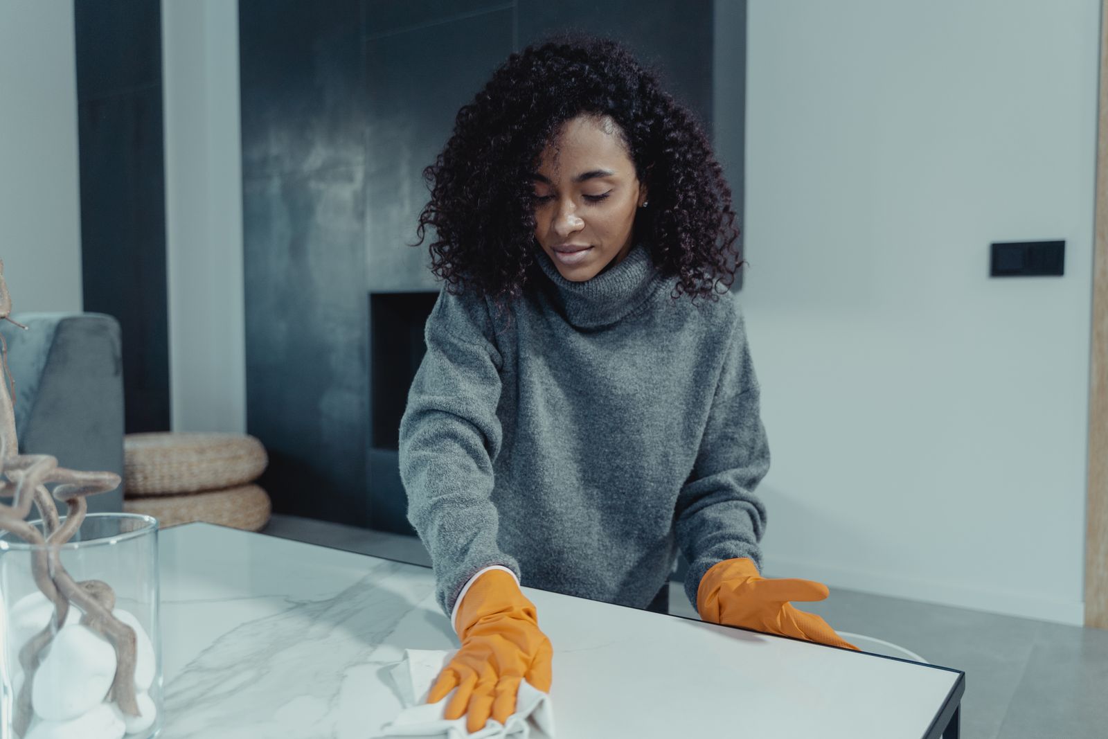 Domestic helper organizing a living room