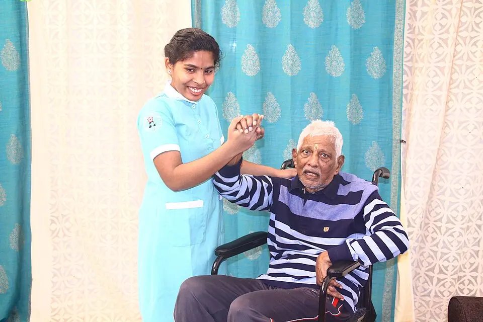 Home care nurse assisting an elderly patient